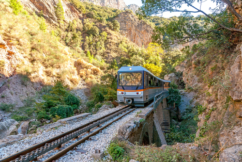 View of the Odontotos rack railway train from Diakopto to Kalavrita, under Helmos mountain. About 120 years ago Odontotos rack railway started from the seaside town of Diakopto parallel to the river and climbed to Kalavrita, The Peloponnese, Greece