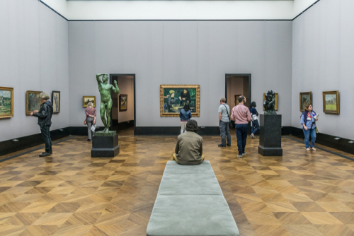 Scenic view of visitors observing statues and paintings of Monet, Cezanne and Renoir in an exhibition of the Alte NationalGalerie at the Museum Island in Berlin, Germany