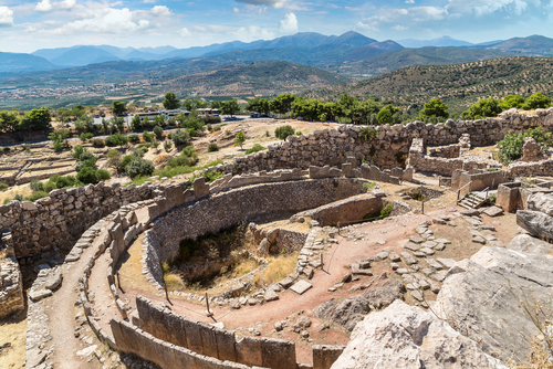 Aerial view of the tomb of the Kings and ruins of the ancient city Mycenae, the Peloponnese, Greece on a Summer day