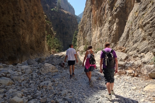 People hiking the hiking trail at the National Park Samaria Gorge, near Chania, Island of Crete, Greece