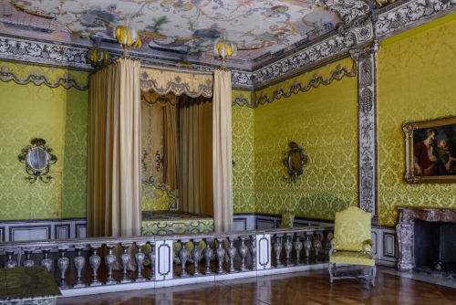 Luxury interior of State Bedroom in the Electress Apartment in Schleissheim Schloss near Munich, Bavaria, Germany. The room is divided by balustrade into an anteroom and an alcove containing bed