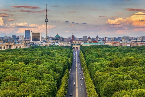 Berlin city skyline in Germany, aerial view above Tiergarten park towards the Brandenburg Gate