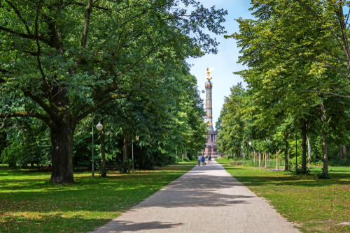 View of a pathway and a tree orchard in Tietgarten, Berlin's most popular inner-city park, Germany