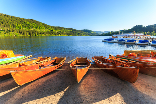 View of boats on the banks of Titisee Lake in the Black Forest, Baden-Württemberg, Germany