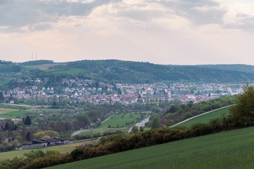 View over fields to the lovely Taubertal with the town Tauberbischofsheim and the romantic street, Bavaria, Germany