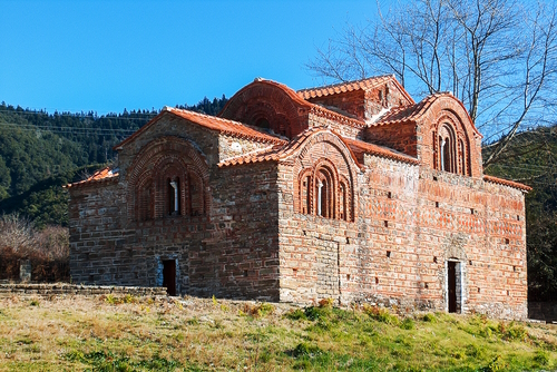 Exterior view of the red church in Vourgareli village, Tzoumerka, Epirus, Greece
