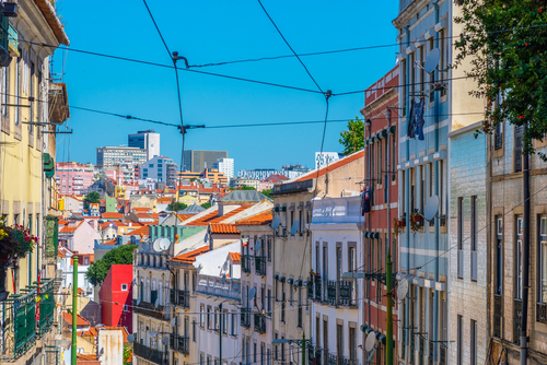 View of a narrow street at the Alfama district in Lisbon, Portugal
