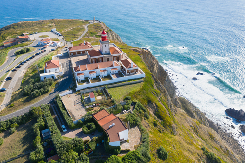 Aerial view of Cabo da Roca and the lighthouse over Atlantic Ocean, the most westerly point of the European mainland, Sintra, Portugal