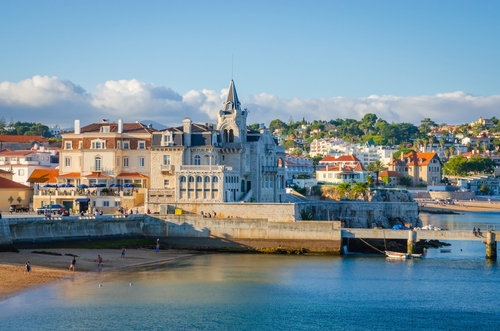 eautiful coast of old town Cascais, Portugal, at sunset in summer day