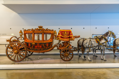 Interior of the national museum of coaches in Belem and a coach display, Lisbon, Portugal