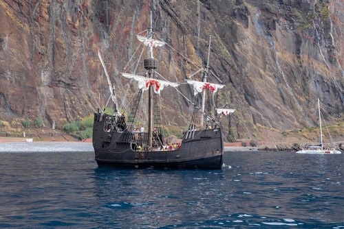 A Saile Boat near the coastline of Funchal , Madeira Island, Portugal