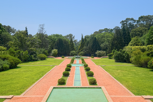 Symmetric view of alley with cascaded fountains in the Serralves Park of Porto, Portugal