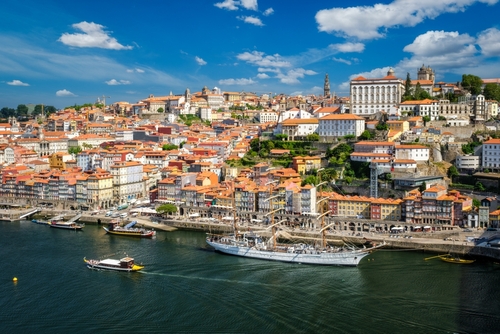 Aerial view of Porto city and Douro river with moored sailing ship from Dom Luis bridge I, Porto, Portugal