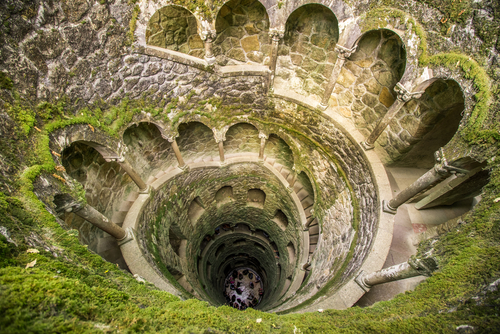 The Masonic Initiation well (Poço Iniciático) in Quinta da Regaleira is one of the attractions of the palace and garden part of a network of underground tunnels connecting different parts of the garden, in Sintra near Lisbon, Portugal