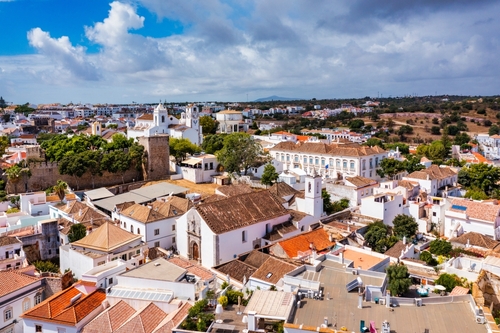 The historic town of Tavira with Clock tower and St Marys church, Algarve, Portugal.