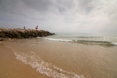Breakwater in Tavira beach, Algarve, Portugal