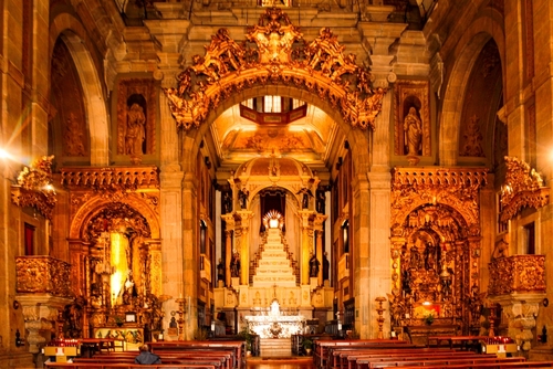The interior of the Carmo church, with the altar in the background, in the city of Porto, Portugal
